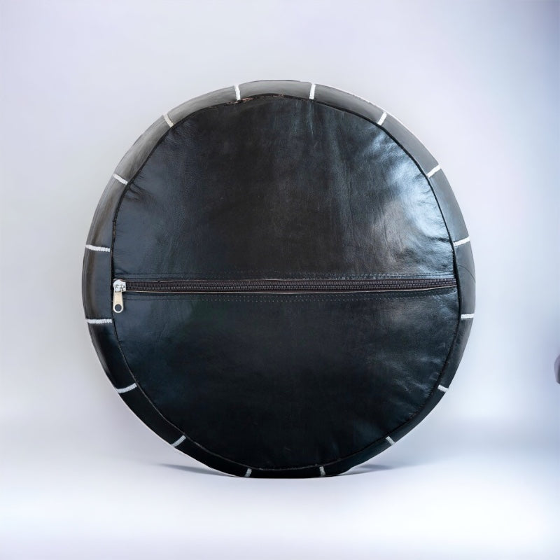 Black leather pouf